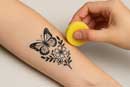arm with tattoo being applied