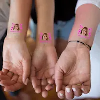 Three wrist shwoing off temporary tattoos